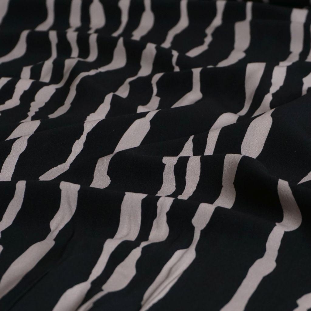 Viskose Druck unregelmäßige Streifen schwarz beige
